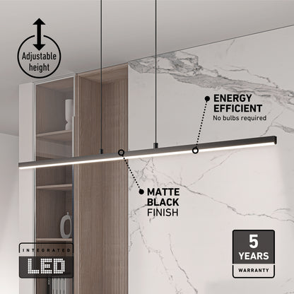 The Delta LED Linear Pendant 36IN in matte black hangs in a minimalist kitchen. This modern fixture offers adjustable height, energy efficiency with built-in LEDs, and a 5-year warranty, shown alongside graphic text.