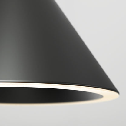 Close-up of the Denali LED Pendant 3CCT, featuring a modern black cone-shaped shade with a white inner edge, softly illuminated against a plain light gray background.