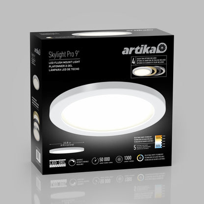 A black box for the 9" LED Skylight with 3 colour trim rings shows the round fixture, product features, and specs such as a 50,000-hour lifespan, 1300 lumens output, interchangeable trims, and adjustable colour balance.