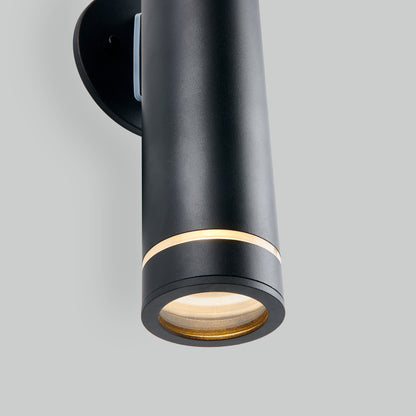The C7 Pro Outdoor LED Wall Light is a sleek, modern black cylindrical sconce with a circular base and a narrow band of warm light near the top, shown on a light gray background.