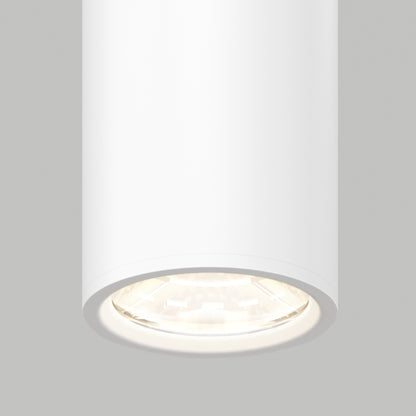 A close-up view of the Damian LED Cylinder Pendant, a modern white ceiling light with a glowing bulb, set against a plain gray background.
