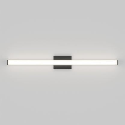 The Mylo LED Vanity Light 36IN is a modern, horizontal wall-mounted fixture featuring a long white illuminated bar attached to a central dark rectangular base on a plain light gray wall.