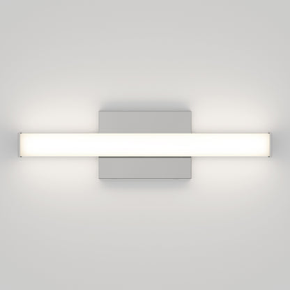 The Mylo LED Vanity Light 16IN is a modern, rectangular wall-mounted fixture with a minimalistic design that emits a soft white glow, providing even, diffused illumination on surrounding white walls.