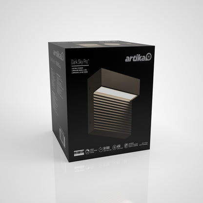A matte-black Artika Dark Sky Pro Indoor/Outdoor LED Wall Sconce Small box is displayed on a white background, showcasing product images, the brand logo, and key specifications on its packaging.