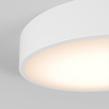A black Concerto LED flush mount light fixture with a round white shade.