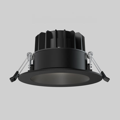 The Skyview 4in Regressed Round, 5CCT LED is a black recessed pot light with circular trim, spring clips, and finned heat sink, offering adjustable color temperature and sleek lighting against a plain gray background.