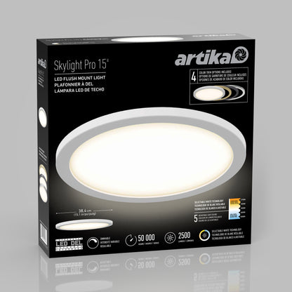 A black and gray box of Artika 15" LED Skylight with 3 colour trim rings shows a round light, product features, brightness, energy details, and adjustable color options on the packaging.