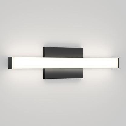 The Mylo LED Vanity Light 16IN features a modern wall-mounted design with a rectangular black base and a long frosted glass bar, casting a soft white glow on any plain light gray wall.