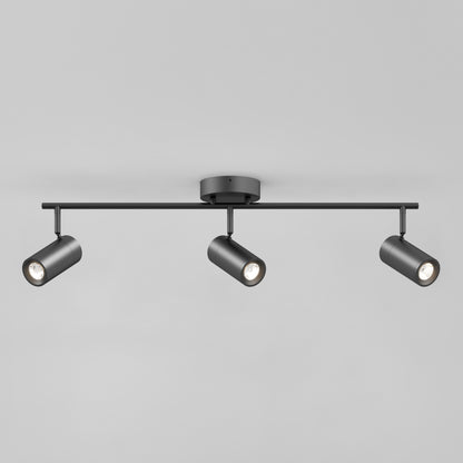The Alpha LED Track 3-Light is a modern black ceiling fixture with three adjustable cylindrical spotlights on a horizontal bar, each aimed in a different direction, shown against a plain gray background.