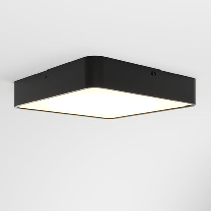 The LYDEL LED Ceiling Light, a modern black fixture with a square shape and rounded corners, casts a bright, even glow against a plain white ceiling background.