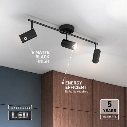 The Alpha LED Track 3-Light, a matte black fixture with three integrated LED heads, is mounted above wooden cabinets. Labels indicate Matte Black Finish, Energy Efficient, and 5 Years Warranty.