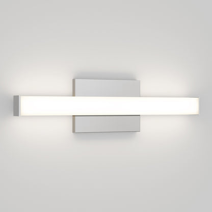 The Mylo LED Vanity Light 16IN is a modern wall-mounted fixture with a frosted rectangular glass shade and sleek metal base, emitting a soft, even glow against a plain white wall.