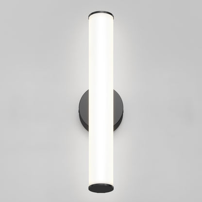 The Kalio Indoor LED Wall Sconce 18" casts a bright white glow against a light gray backdrop, its sleek tubular design elevating the space with modern style.