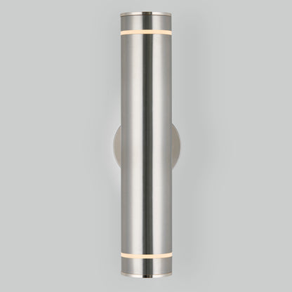 The C7 Pro Outdoor LED Wall Light is a modern cylindrical sconce in brushed metal, mounted vertically on a light gray wall, emitting light from both the top and bottom edges.