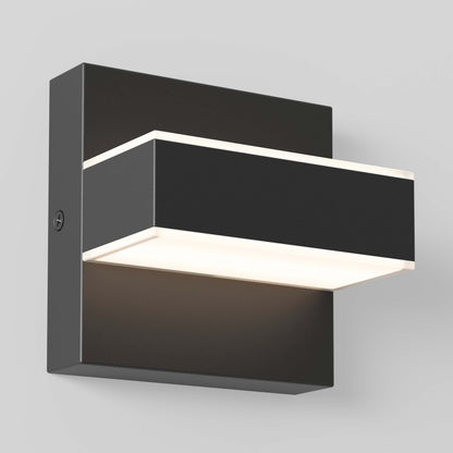 The Mezzo LED Indoor/Outdoor Wall Sconce Light features a modern rectangular design with a black metal finish and glowing white light panels on the top and bottom, mounted on a light gray wall.