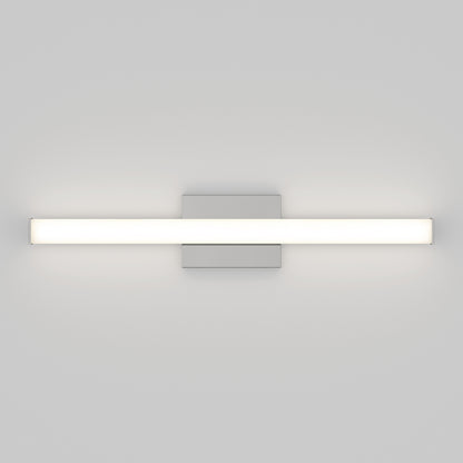 The Mylo LED Vanity Light 24IN features a minimalist, wall-mounted design with a horizontal rectangular white light bar attached to a central square metallic base, shown against a plain light gray wall.