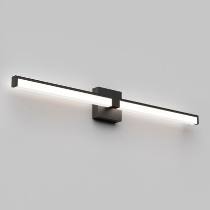 The Tivoli 36'' LED Vanity Light is a modern, rectangular wall-mounted fixture with a black frame and central base, casting a soft white glow against a plain gray wall.