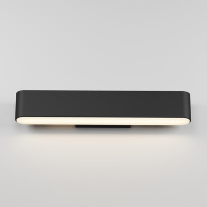 The Willow LED Vanity 3CCT Light features a modern rectangular black design with rounded edges, mounting easily on a white wall and casting a soft, even downward glow—ideal as a bathroom mirror light for contemporary spaces.