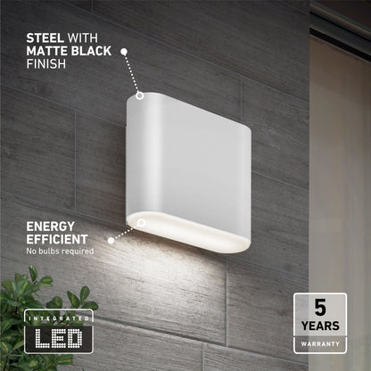 The Willow LED Indoor/Outdoor Wall Light, featuring a matte black steel finish, is shown mounted on a gray tiled wall. Text highlights its energy efficiency, integrated LED, and 5-year warranty.