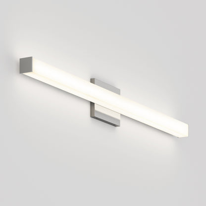 The Mylo LED Vanity Light 36IN is a modern, rectangular wall-mounted fixture with a sleek minimalist design, emitting a soft white glow against a plain light-colored wall.