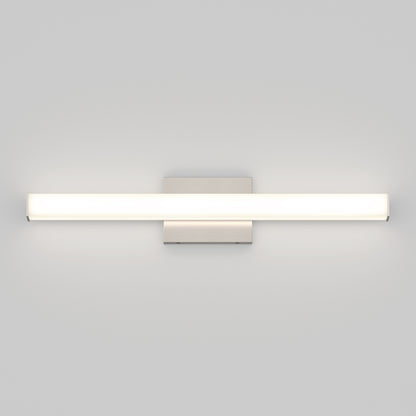 The Mylo LED Vanity Light 24IN features a horizontal frosted rectangular light bar and metallic mounting plate, casting a soft, even glow against a plain light-gray wall.