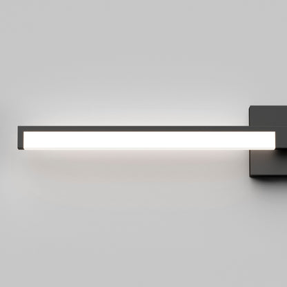 The Tivoli 36'' LED Vanity Light is a modern rectangular wall-mounted fixture with a black frame, casting bright white light against a plain light gray wall.