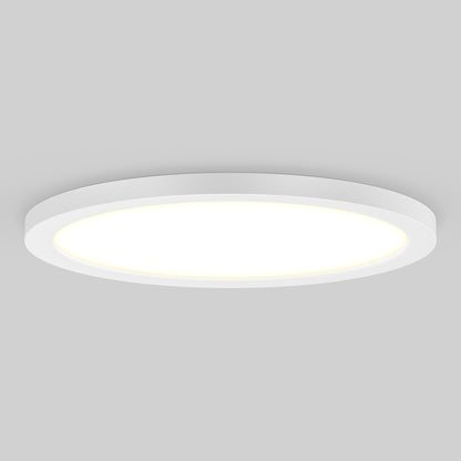 The Skylight Pro 15 3K LED Flat Panel Light features a modern, round, white design and emits a soft, even glow against a plain light gray background.