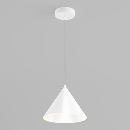 The Denali LED Pendant 3CCT, featuring a modern white conical shade, hangs from the ceiling on a slim cord against a light gray background. The lamp is lit, softly glowing from the inner rim of its shade.