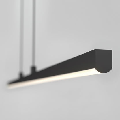 The Delta LED Linear Pendant 36IN features a modern, minimalist rectangular design in black, suspended from the ceiling by two cables and casting a soft, even glow against a light gray background.
