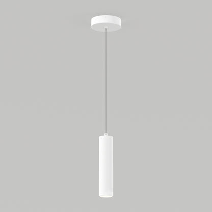 The Damian LED Cylinder Pendant, featuring a minimalist white cylindrical shade, hangs from the ceiling by a thin cord against a plain gray background.
