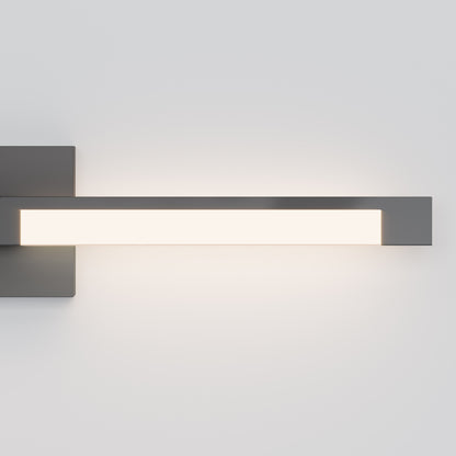 The Tivoli 27'' Vanity Light features a rectangular black metal base and a horizontal frosted light bar, casting a soft white glow against a plain light gray wall.