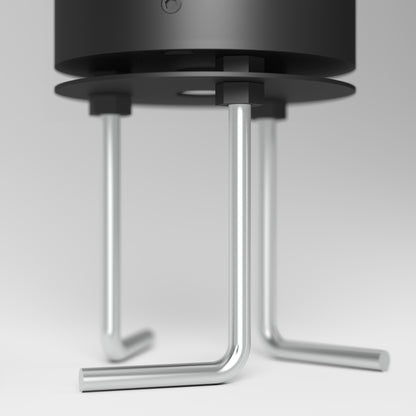 Close-up of the chrome-finished, angled metal legs supporting the Dark Sky Pro LED Outdoor Pathway Light Stick’s modern black cylindrical body, set against a light background.