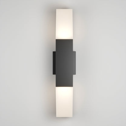 The Lennox Pro LED Outdoor Wall Light features a sleek black rectangular fixture with frosted white glass covers on the top and bottom, casting a soft glow against a plain light gray wall.