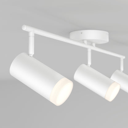 The 32" Blake 3L tracklight features three modern, white cylindrical LED spotlights on a horizontal bar, shown against a light gray ceiling—perfect accent lighting for contemporary interiors.