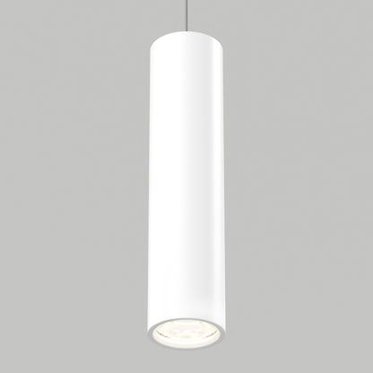 The Damian LED Cylinder Pendant, a modern white fixture, hangs from the ceiling against a plain gray background, casting a soft glow downward.