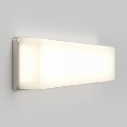 The Aster 27in Energy Star LED Vanity Light, featuring a frosted white cover, emits a soft, even glow and is mounted on a plain light gray wall.