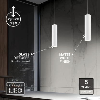 Two Damian LED Cylinder Pendants with matte white finish and glass diffusers hang before a marble wall. Labels highlight their adjustable height, integrated LED, and 5-year warranty.