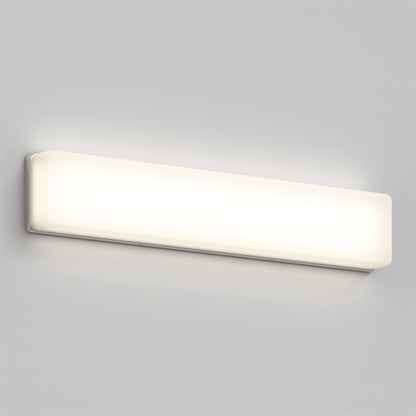 The Aster 27in Energy Star LED Vanity Light is a rectangular, wall-mounted fixture with a frosted cover that emits a soft, even glow against a light gray wall.