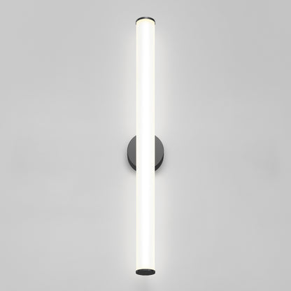 The Kalio Indoor LED Wall Sconce 32" features a modern cylindrical glowing white tube mounted vertically on a round black base, shown against a plain light gray background. Suitable for 0-10V 120-277V.