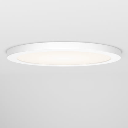 The Skylight Pro 12 3K LED Flat Panel Light is a modern, round, flush-mounted white ceiling fixture with a frosted center, providing a soft, even glow against a white ceiling.