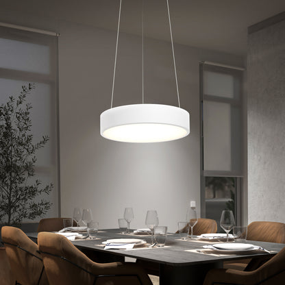 A modern dining room features the Concerto LED Pendant hanging above a set dining table with brown chairs, neatly arranged glassware and plates. Tall windows and an indoor plant complete the elegant setting.
