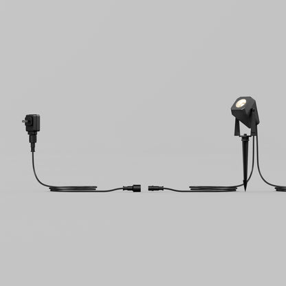 The Verner Plug-in Landscape Single CCT LED 4-pack offers black, weather-resistant wired lights—ideal for outdoor landscape lighting.