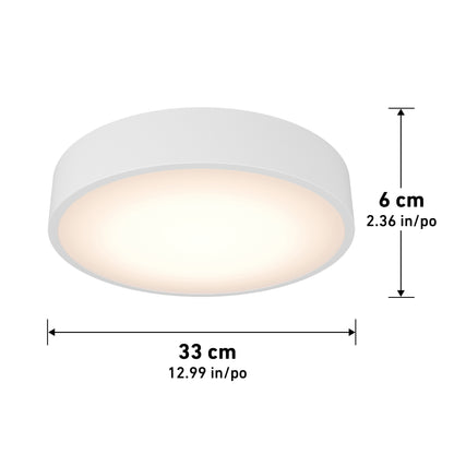 The Concerto LED Flush Mount is a round, white ceiling light with a softly glowing surface, measuring 33 cm (12.99 in) in diameter and 6 cm (2.36 in) high, illustrated with labeled arrows for dimensions.